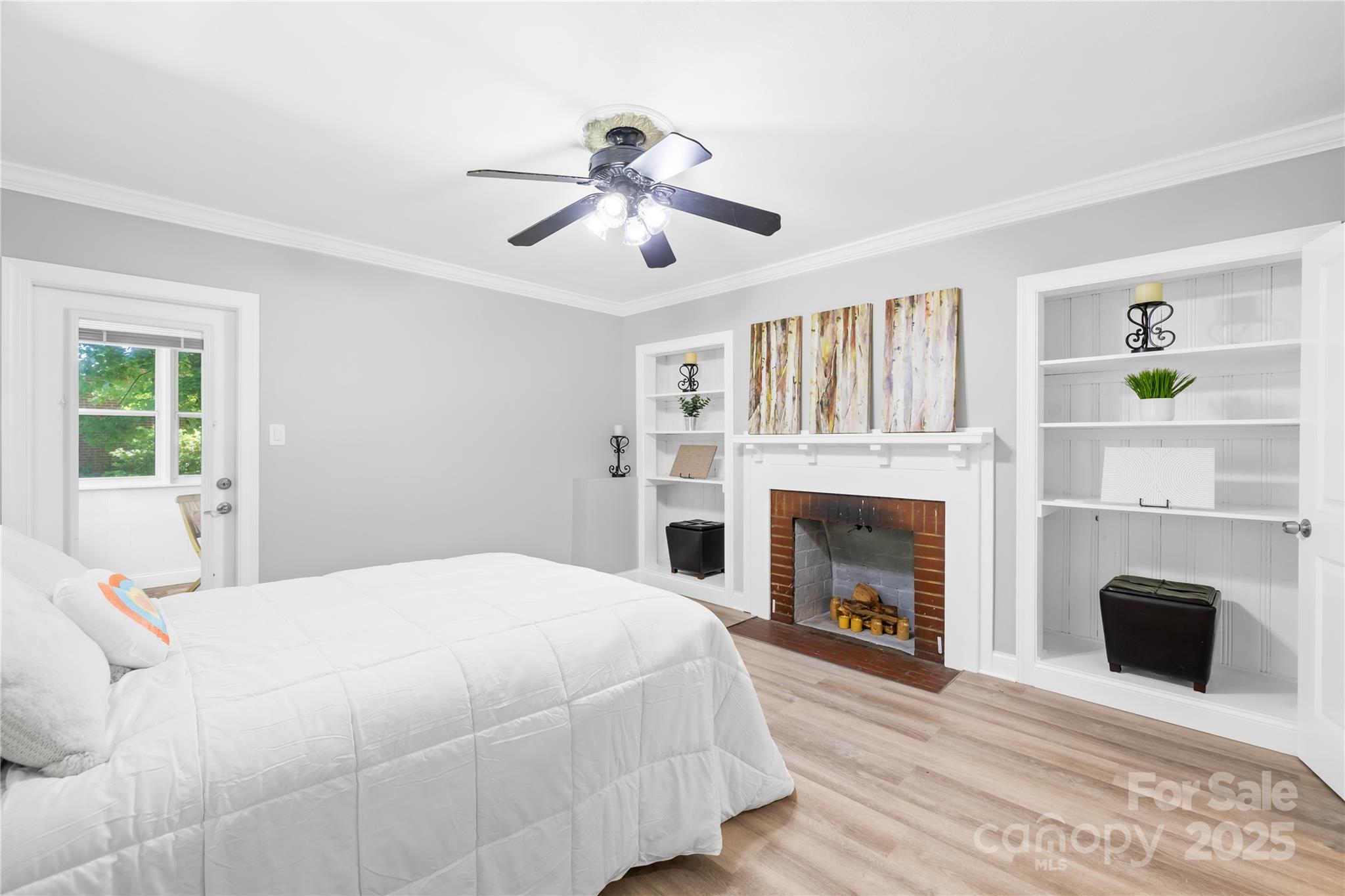 6012 Tuckaseegee Road Charlotte, NC 28208 - Photo 1 of 30 a bedroom with a bed and a fireplace