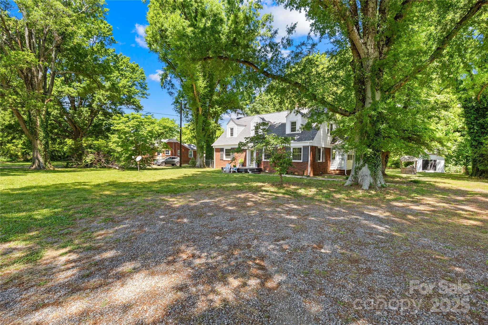 6012 Tuckaseegee Road Charlotte, NC 28208 - Photo 30 of 30 a view of a tree in front of a house