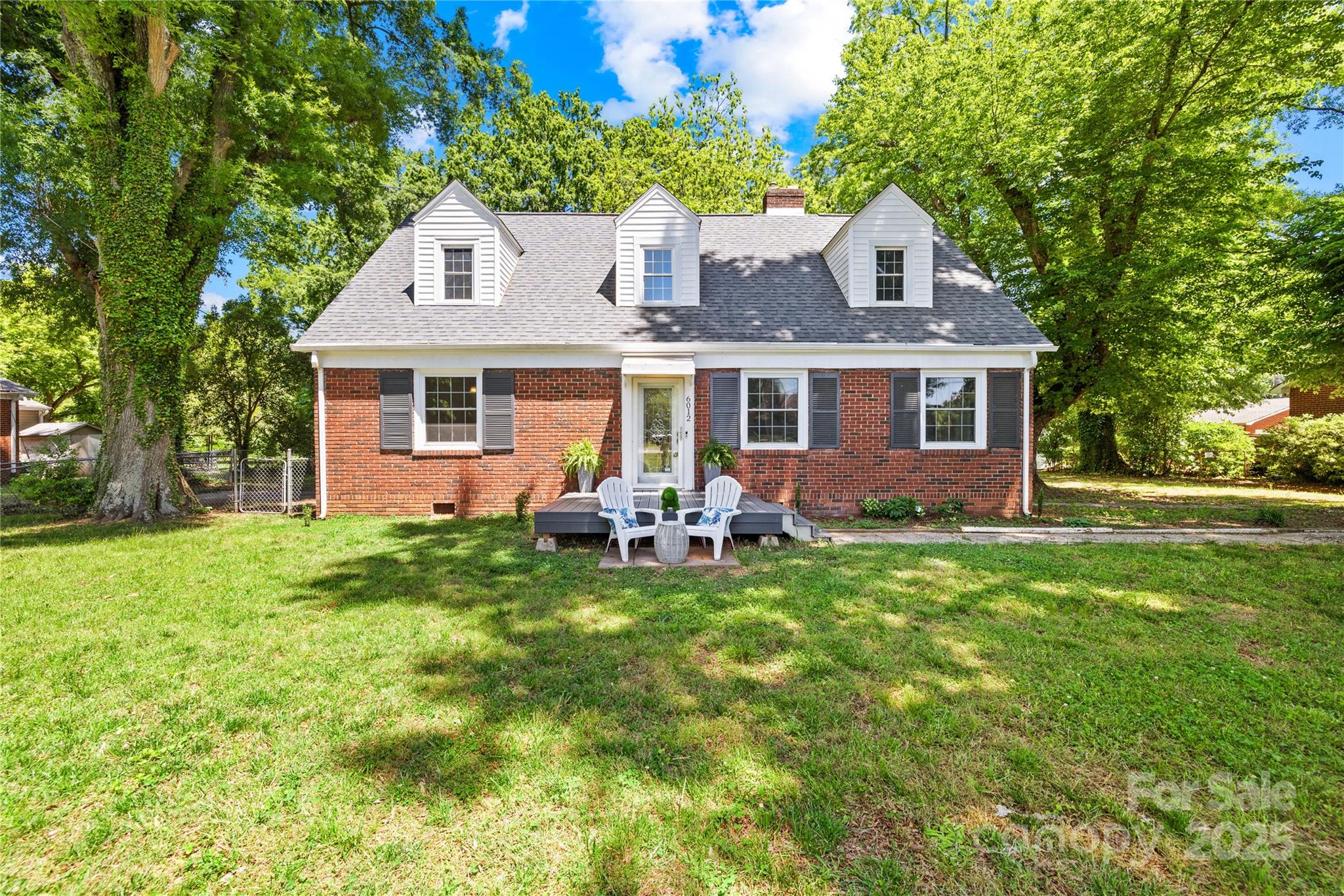 6012 Tuckaseegee Road Charlotte, NC 28208 - Photo 4 of 30 a front view of house with yard and green space