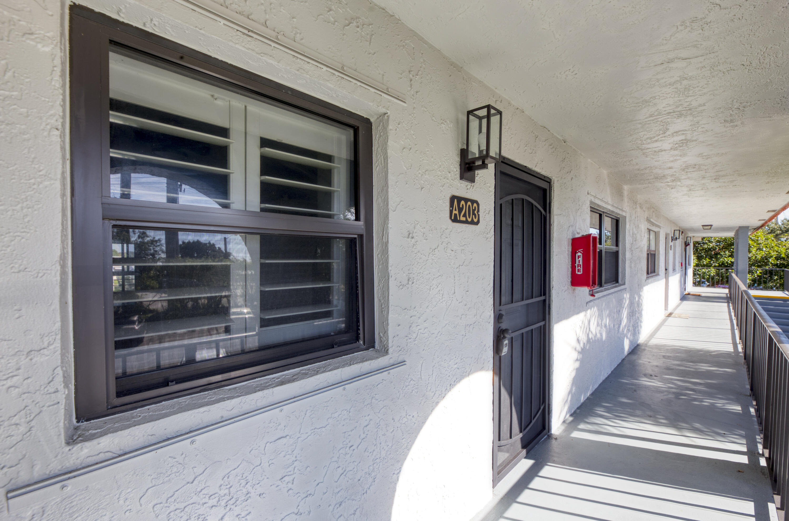 1901 Woolbright Road, Unit A203 Boynton Beach, FL 33426 - Photo 30 of 32 FRONT DOOR AND WALK WAY