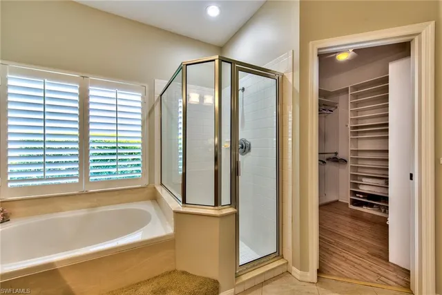 a bathroom with a bathtub and a shower