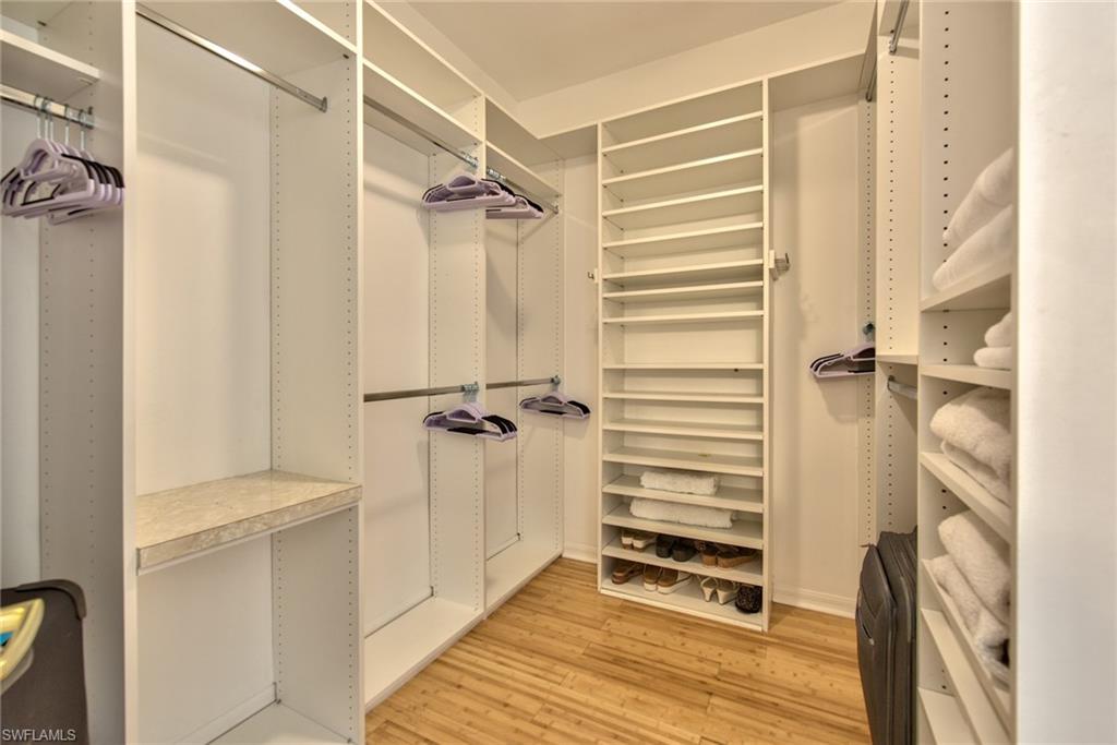 1705 Marsh Run Naples, FL 34109 - Photo 20 of 40 a view of walk in closet with empty racks