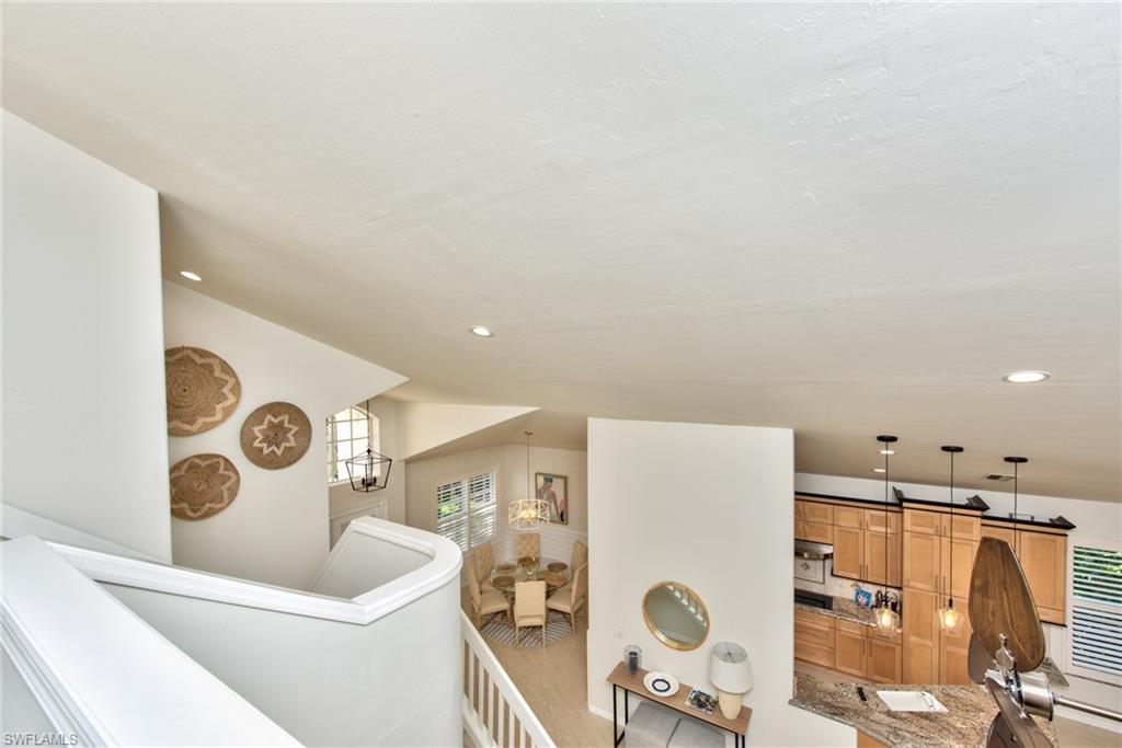 1705 Marsh Run Naples, FL 34109 - Photo 23 of 40 a living room with furniture and a table