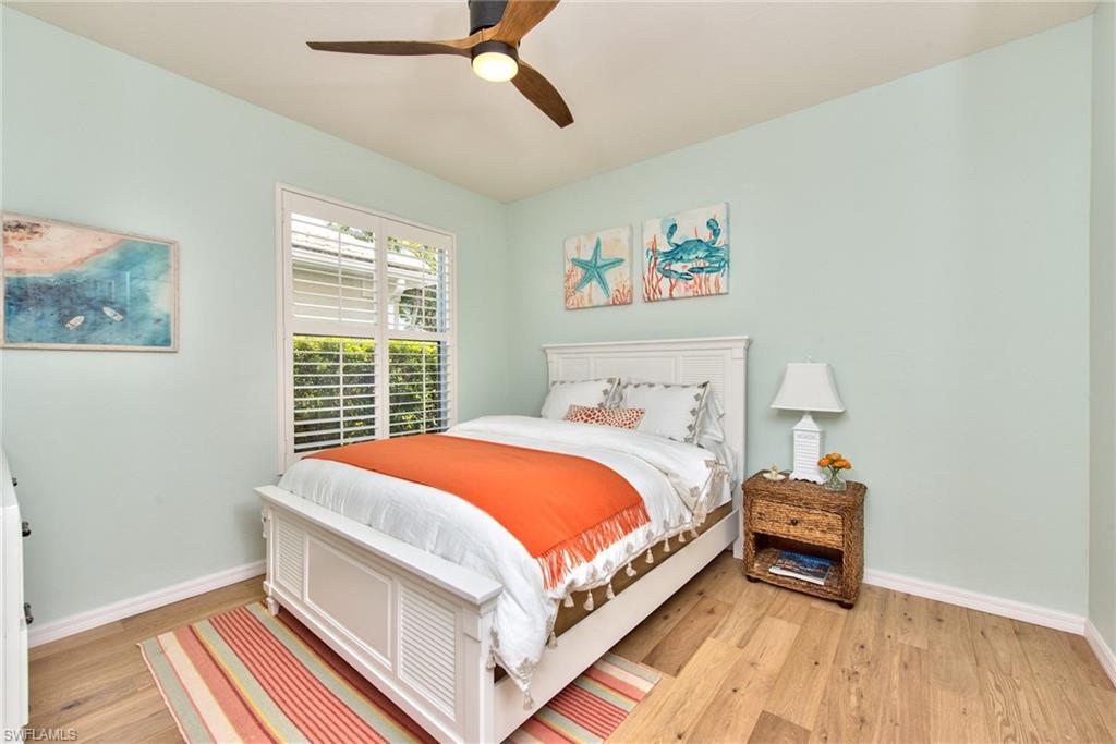 1705 Marsh Run Naples, FL 34109 - Photo 24 of 40 a bedroom with a bed and a window