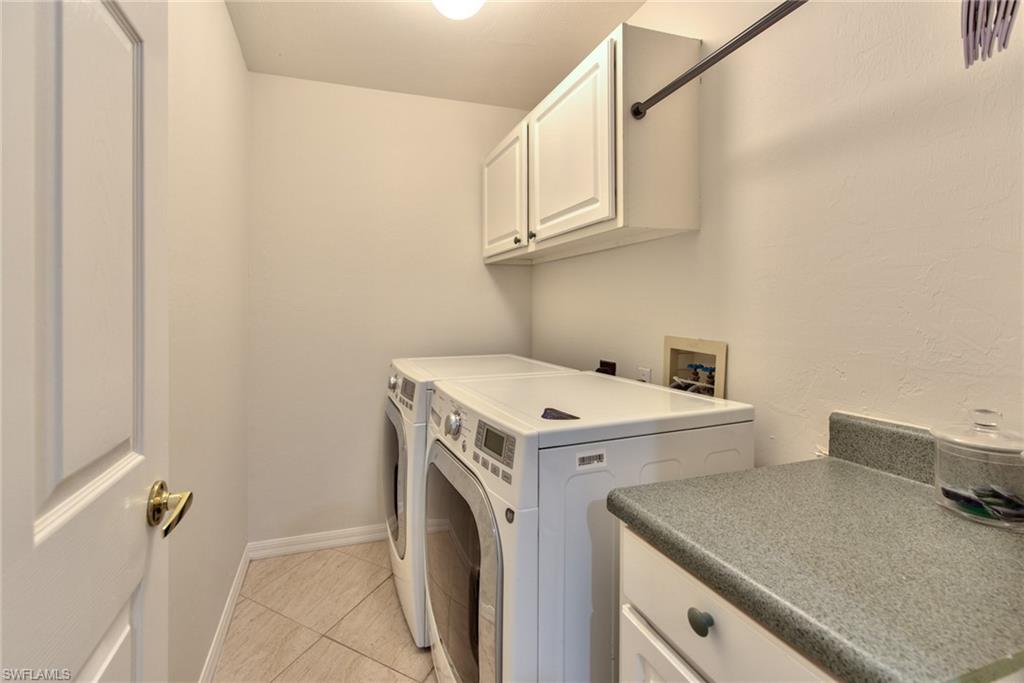 1705 Marsh Run Naples, FL 34109 - Photo 28 of 40 a utility room with dryer and washer