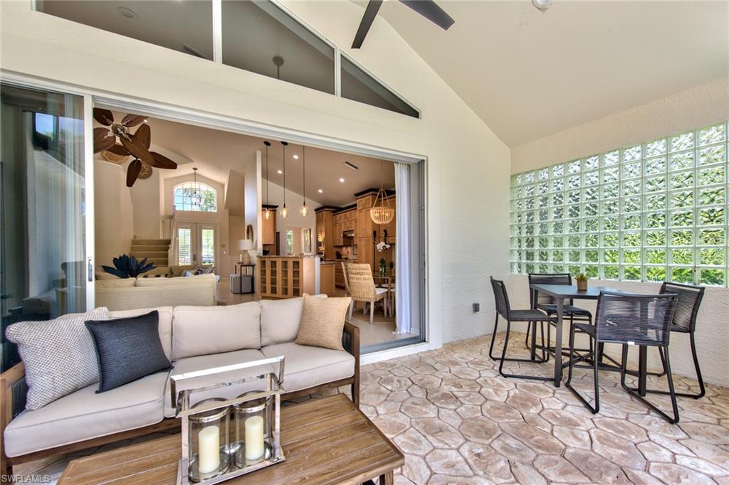 1705 Marsh Run Naples, FL 34109 - Photo 29 of 40 a living room with furniture and a large window