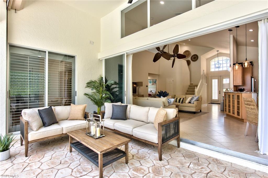 1705 Marsh Run Naples, FL 34109 - Photo 30 of 40 a living room with furniture and a large window