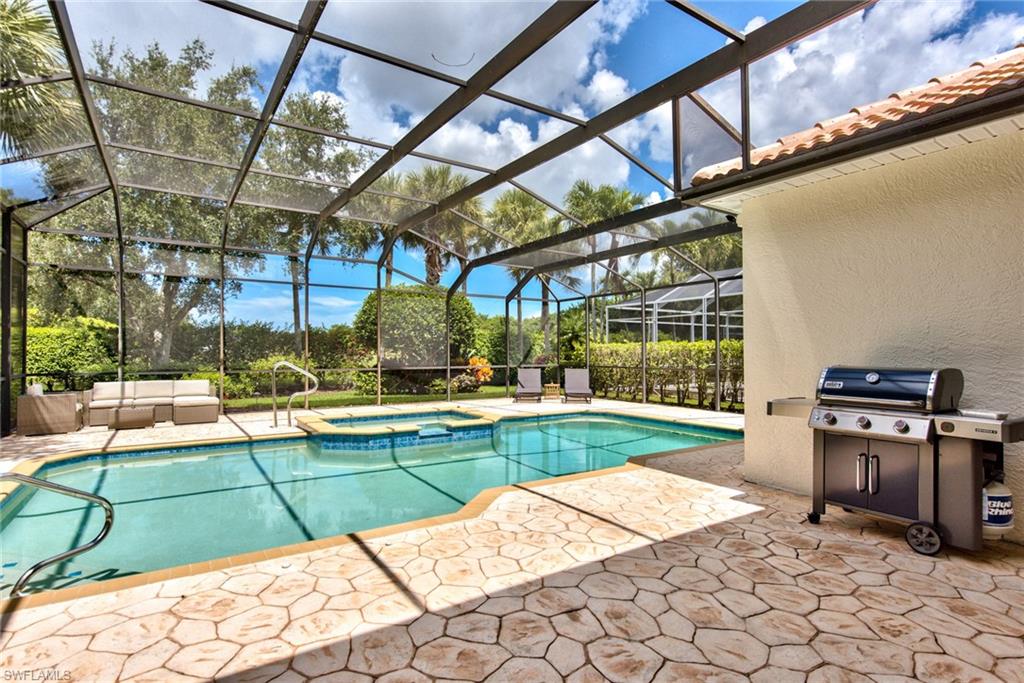 1705 Marsh Run Naples, FL 34109 - Photo 31 of 40 a view of swimming pool with outdoor seating