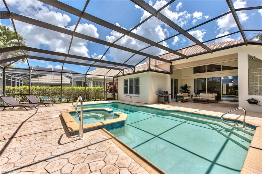 1705 Marsh Run Naples, FL 34109 - Photo 34 of 40 a view of a swimming pool with a patio