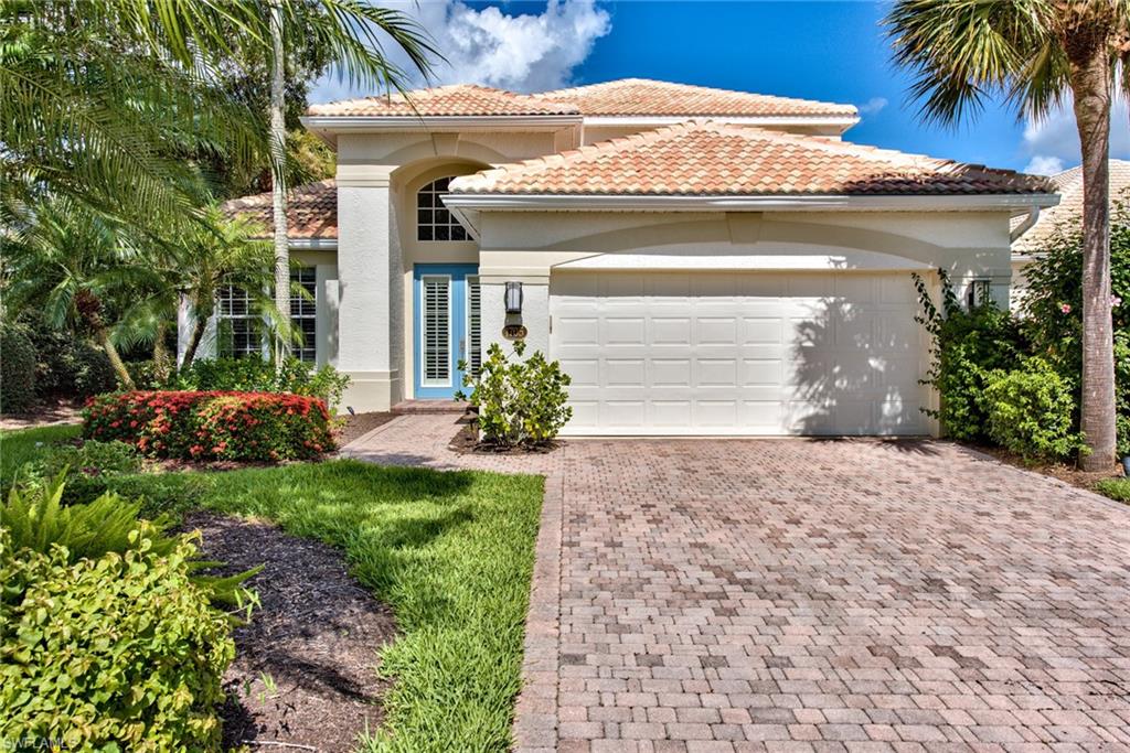 1705 Marsh Run Naples, FL 34109 - Photo 38 of 40 a front view of a house with a garden and plants