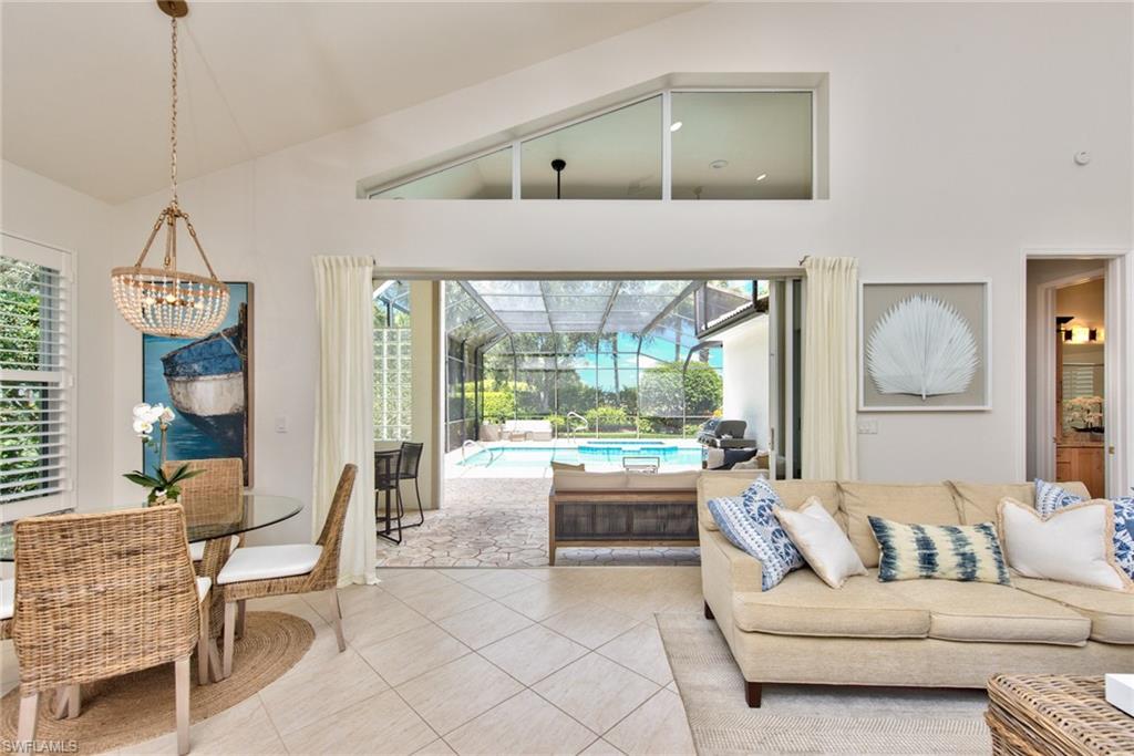1705 Marsh Run Naples, FL 34109 - Photo 8 of 40 a living room with furniture and a large window