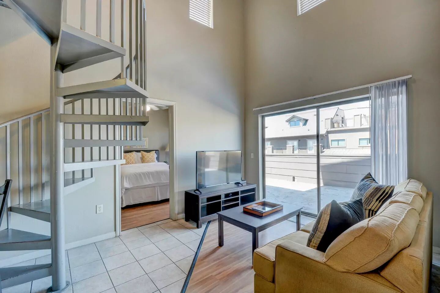 2515 Pearl Street, Unit 602 Austin, TX 78705 - Photo 4 of 5 a bedroom with furniture and a window