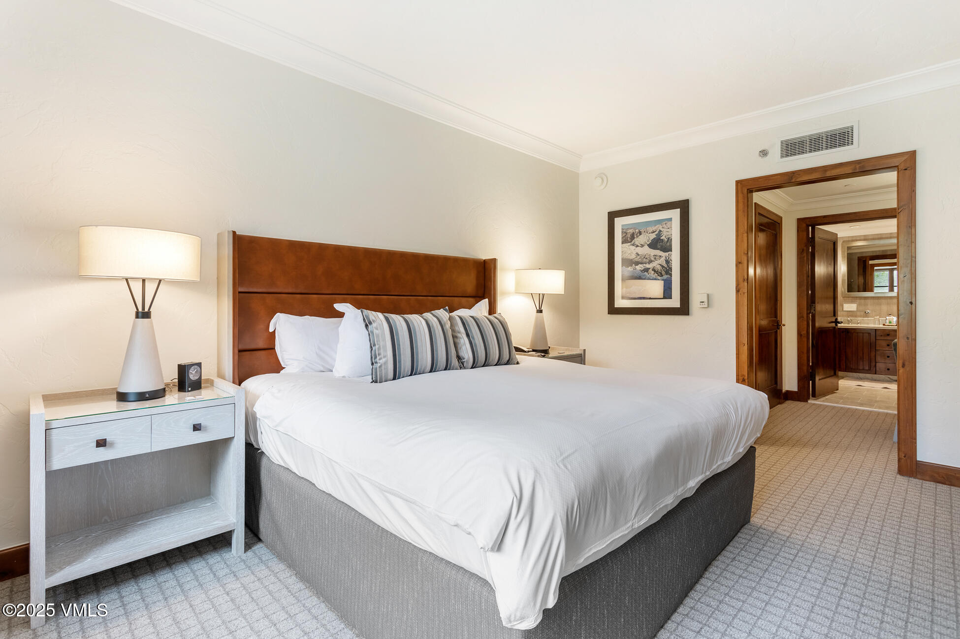 100 Bachelor Ridge Road, Unit 3403 Avon, CO 81620 - Photo 24 of 48 a bedroom with a bed and a lamp