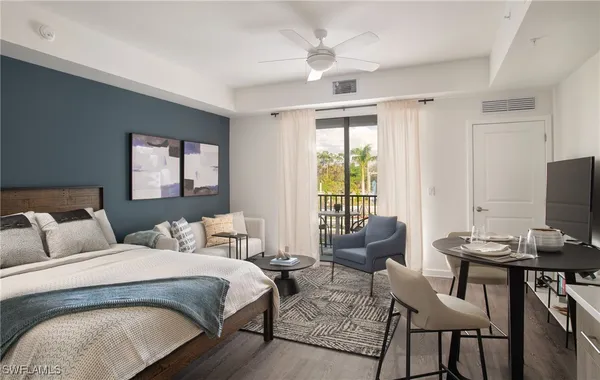 a bedroom with a bed and a couch