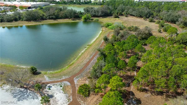 an aerial view of residential house with outdoor space and lake view