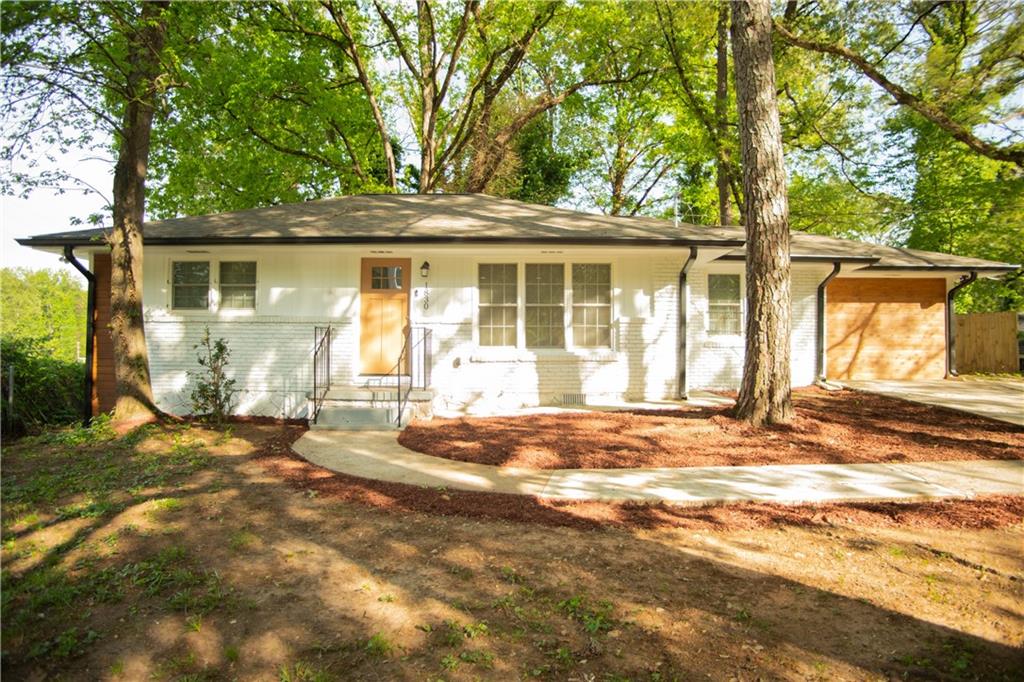 1830 Cindy Drive Decatur, GA 30032 - Photo 1 of 1 a view of a house with backyard and trees