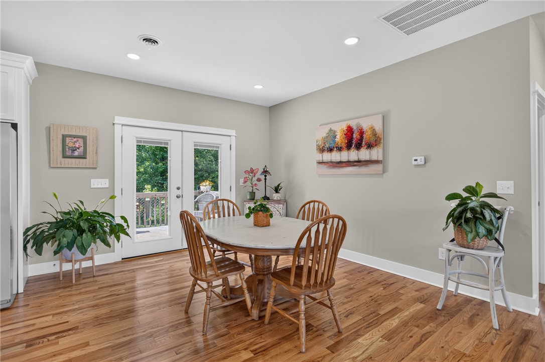 405 Pawnee Drive Walhalla, SC 29691 - Photo 9 of 36 Hardwood floors and recessed lighting elevate this dining area, complete with French doors leading to an outdoor deck.