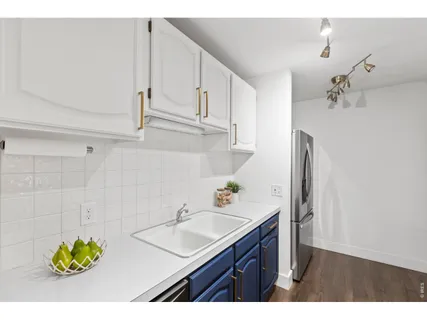 a kitchen with a stove and a refrigerator