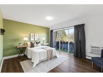 a bedroom with a bed and a chair