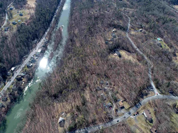a aerial view of a house with a yard