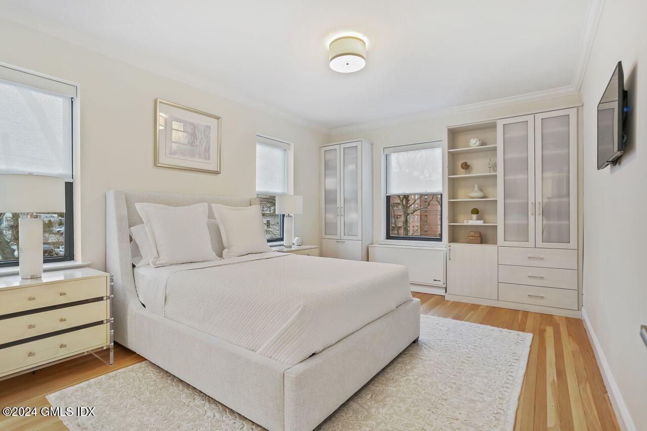 40 West Elm Street, Unit 3G Greenwich, CT 06830 - Photo 13 of 20 a spacious bedroom with a bed and window