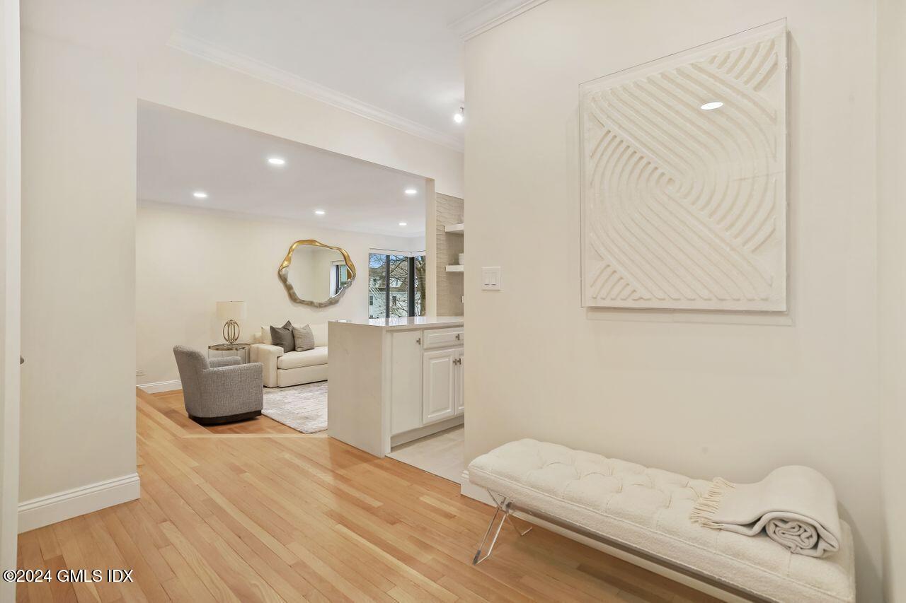 40 West Elm Street, Unit 3G Greenwich, CT 06830 - Photo 2 of 20 a bedroom with a bed and couch