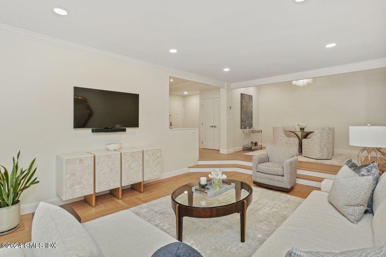 40 West Elm Street, Unit 3G Greenwich, CT 06830 - Photo 10 of 20 a living room with furniture and a flat screen tv