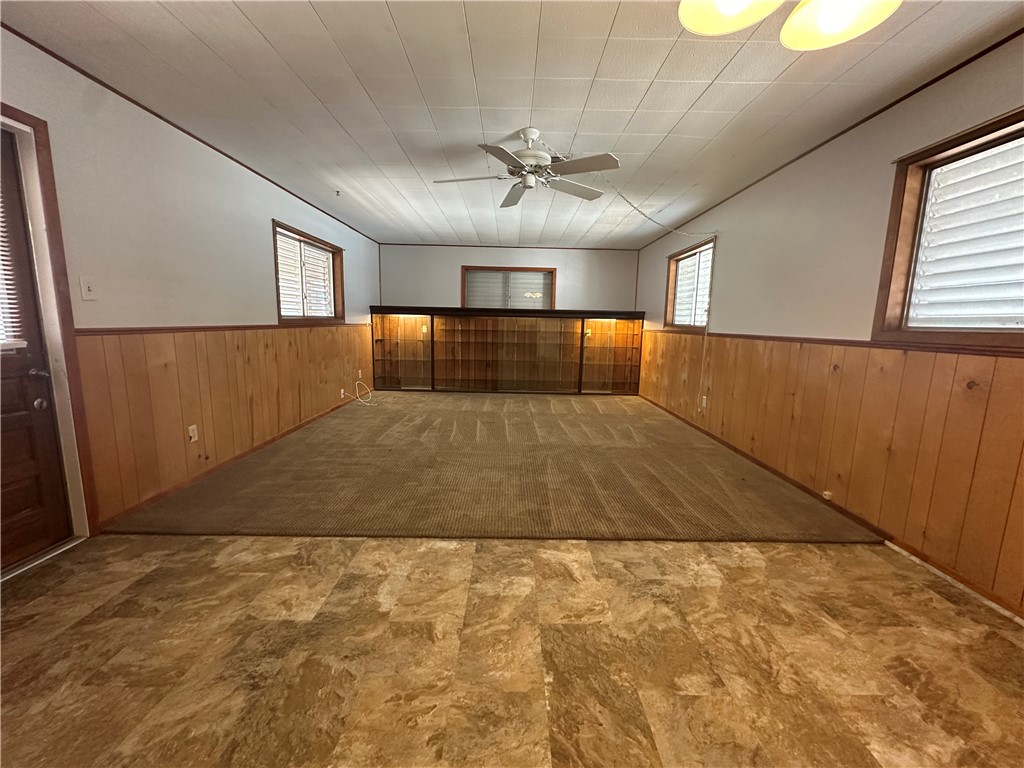 1133 Austin Street Portland, TX 78374 - Photo 11 of 32 a view of empty room with wooden floor and fan