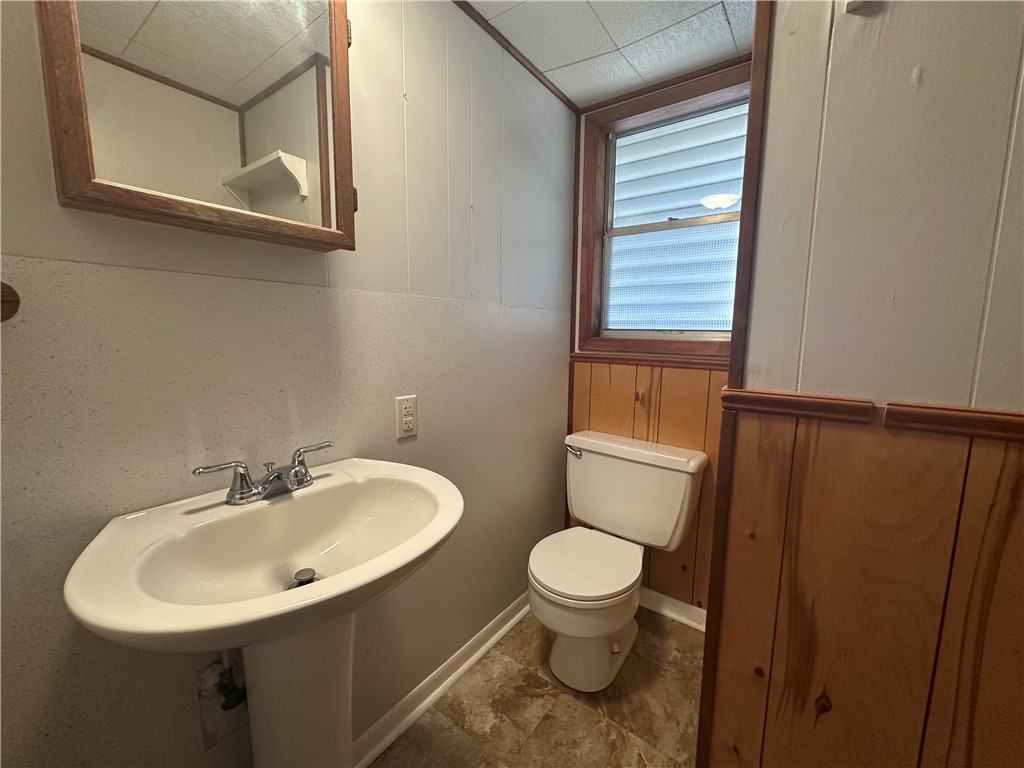 1133 Austin Street Portland, TX 78374 - Photo 17 of 32 a bathroom with a sink toilet and mirror