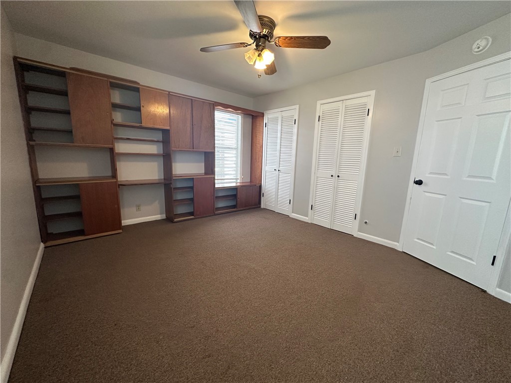 1133 Austin Street Portland, TX 78374 - Photo 24 of 32 a view of empty room with a ceiling fan and window
