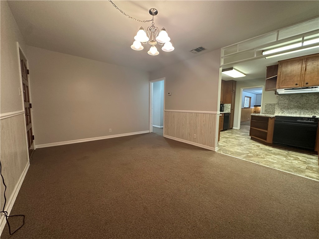 1133 Austin Street Portland, TX 78374 - Photo 4 of 32 a view of a kitchen with a sink and a stove top oven