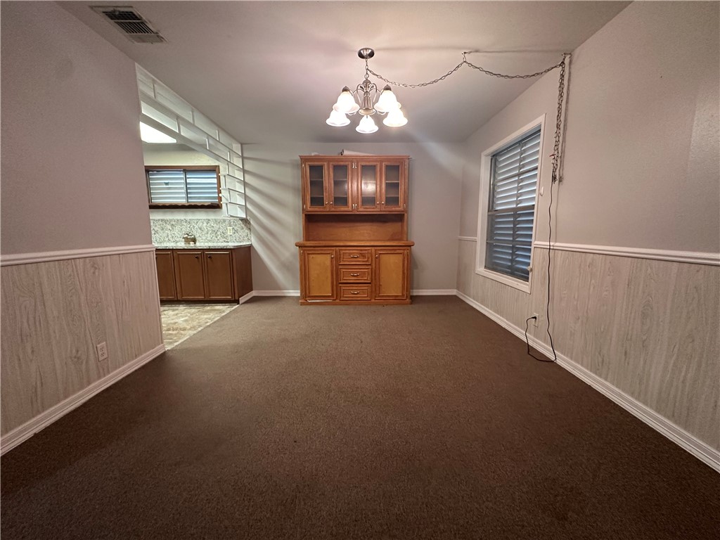 1133 Austin Street Portland, TX 78374 - Photo 5 of 32 a view of a livingroom with a flat screen tv