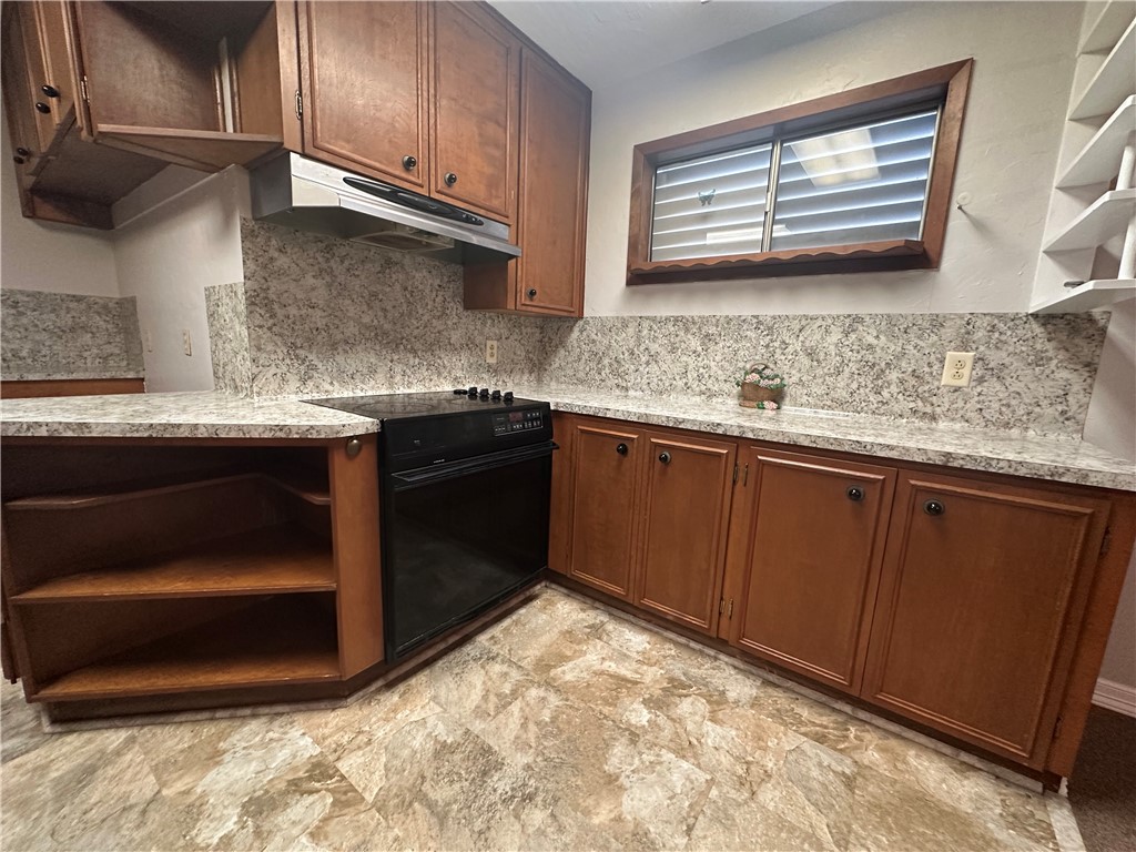 1133 Austin Street Portland, TX 78374 - Photo 8 of 32 a kitchen with stainless steel appliances granite countertop a sink and a stove