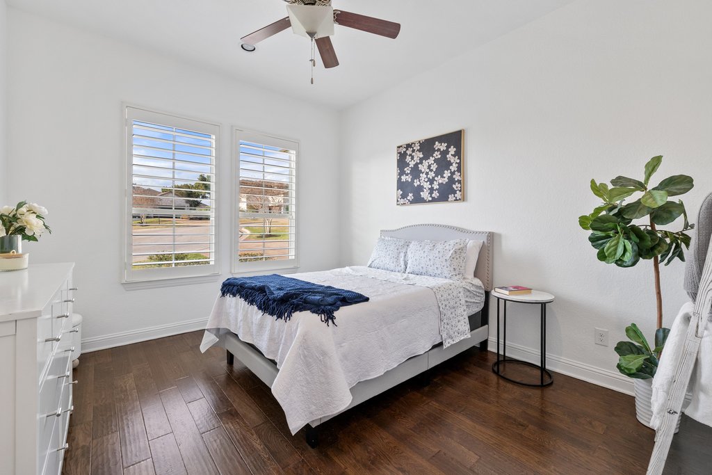 207 San Siro Cove Austin, TX 78738 - Photo 27 of 40 The front bedroom also has wood flooring and overlooks the cul-de-sac.