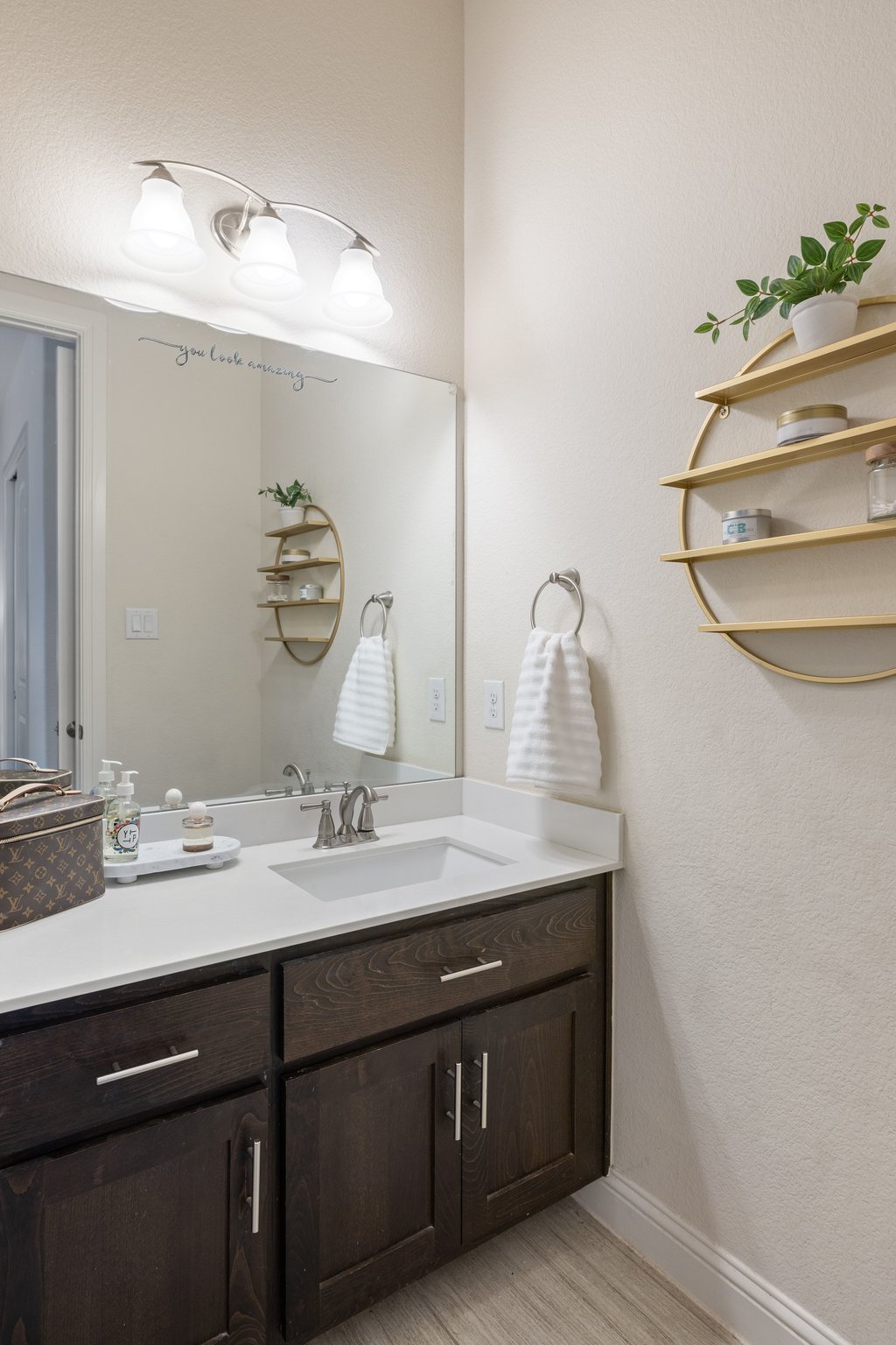207 San Siro Cove Austin, TX 78738 - Photo 29 of 40 The ensuite full bath also showcases ample storage and tile to the ceiling.