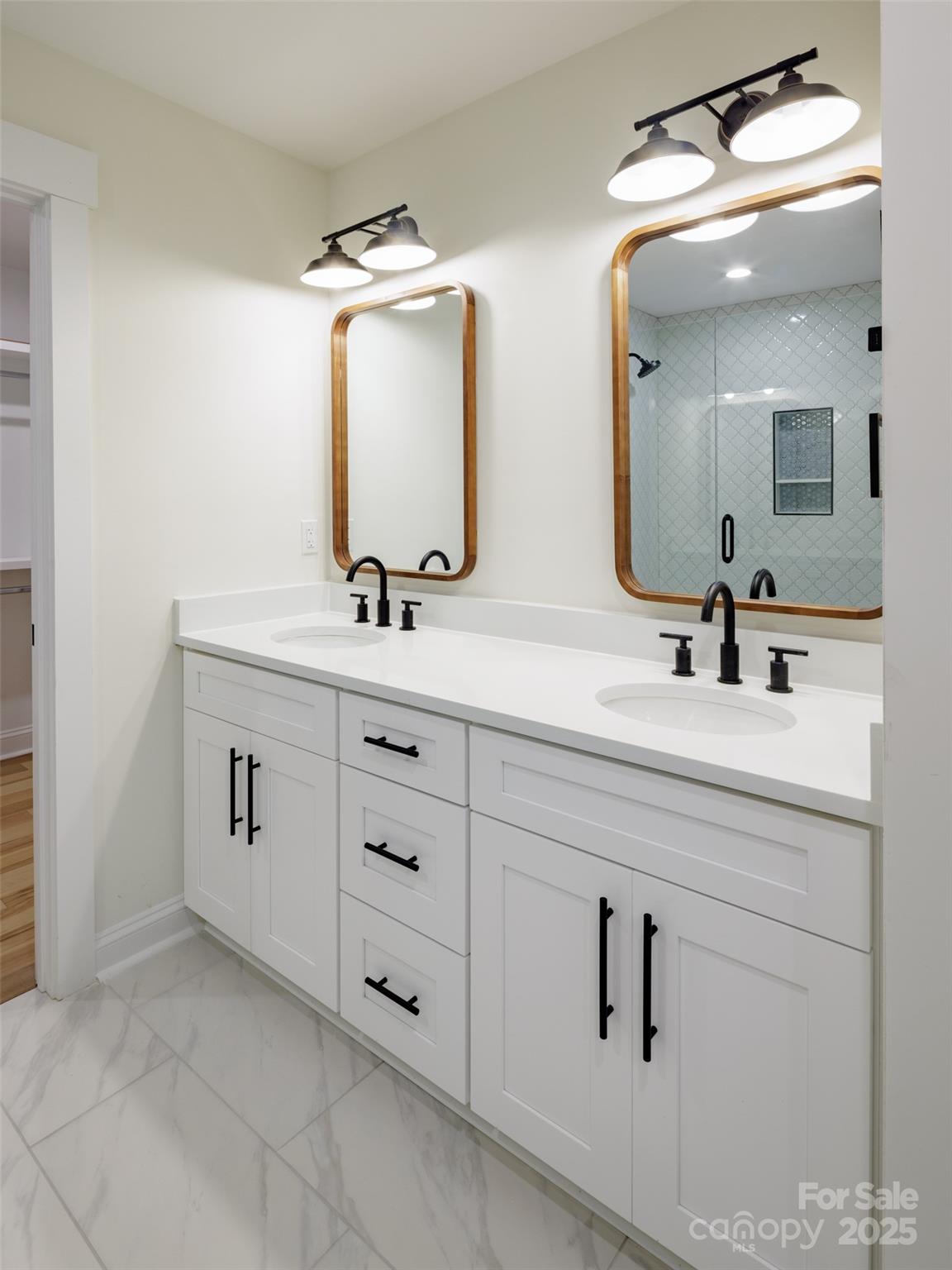 5891 Vinewood Road Davidson, NC 28036 - Photo 15 of 22 a bathroom with double vanity sink and mirror