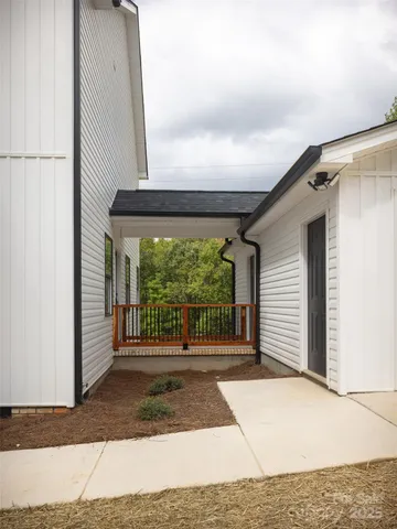 a porch with a bench in front of it