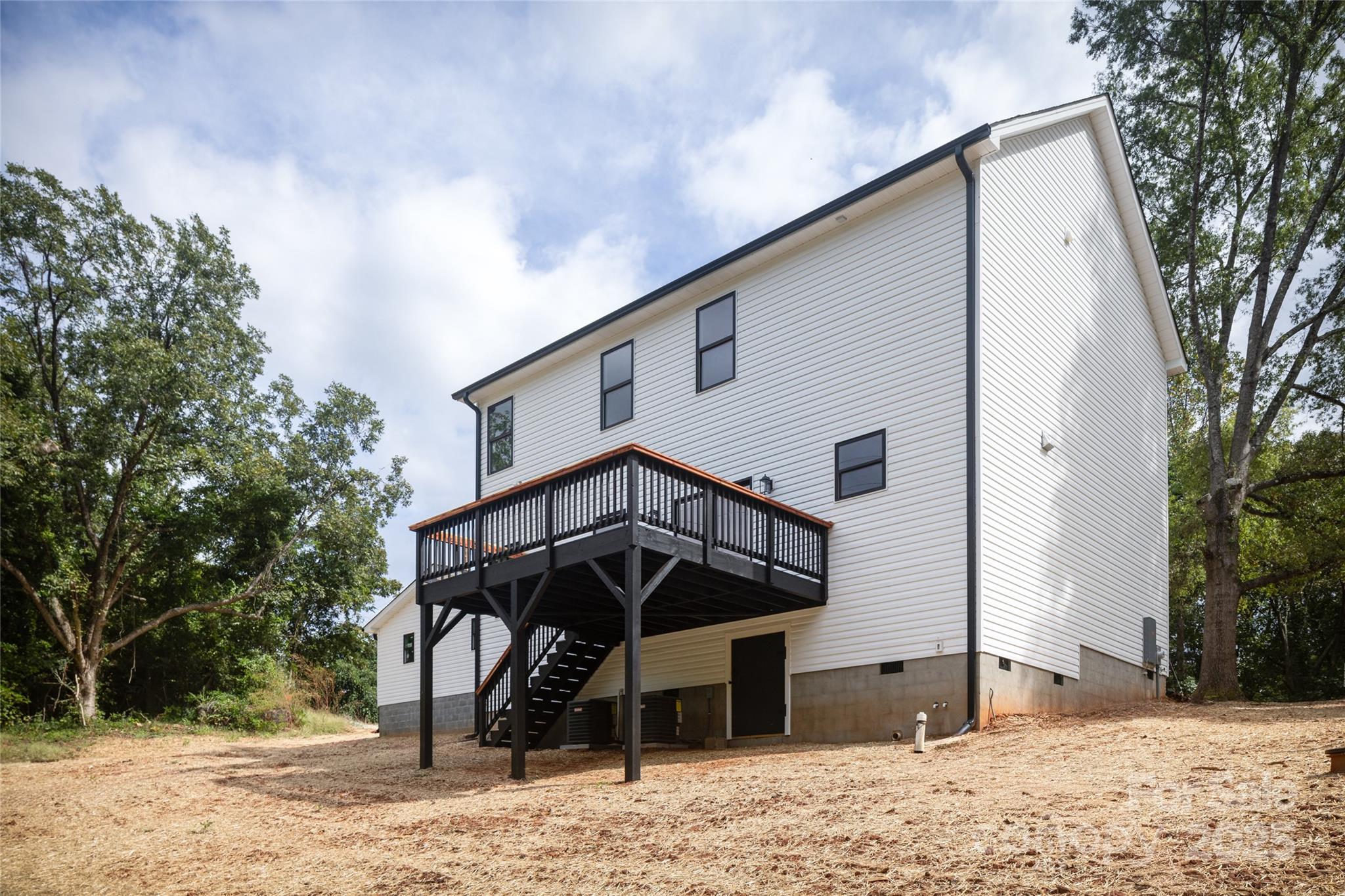 5891 Vinewood Road Davidson, NC 28036 - Photo 5 of 22 a front view of a house with a yard