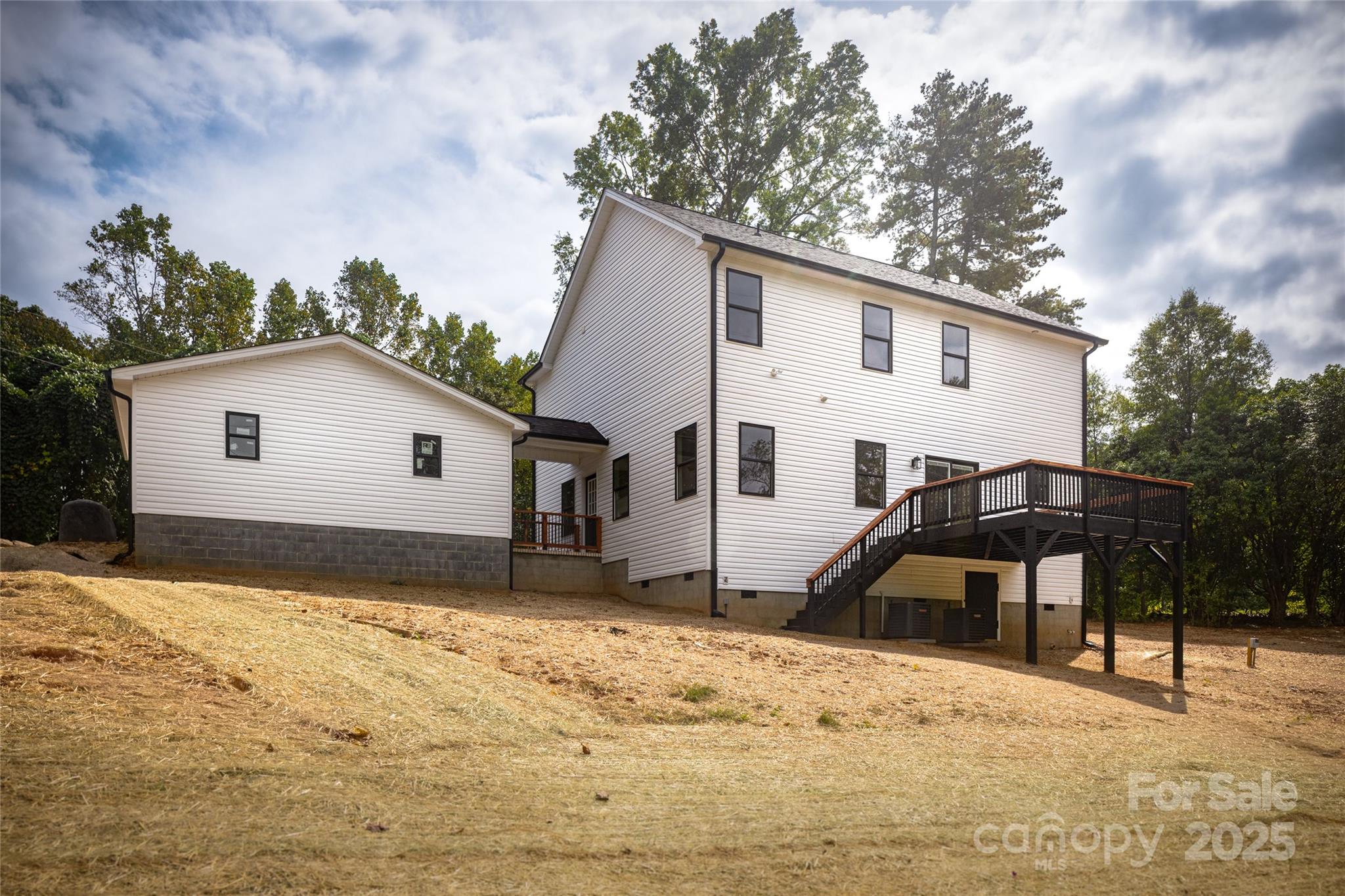 5891 Vinewood Road Davidson, NC 28036 - Photo 6 of 22 a view of a house with a yard covered in snow