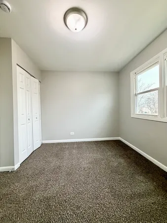 an empty room with a empty space and window
