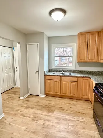 a view of a kitchen with granite countertop window and a sink