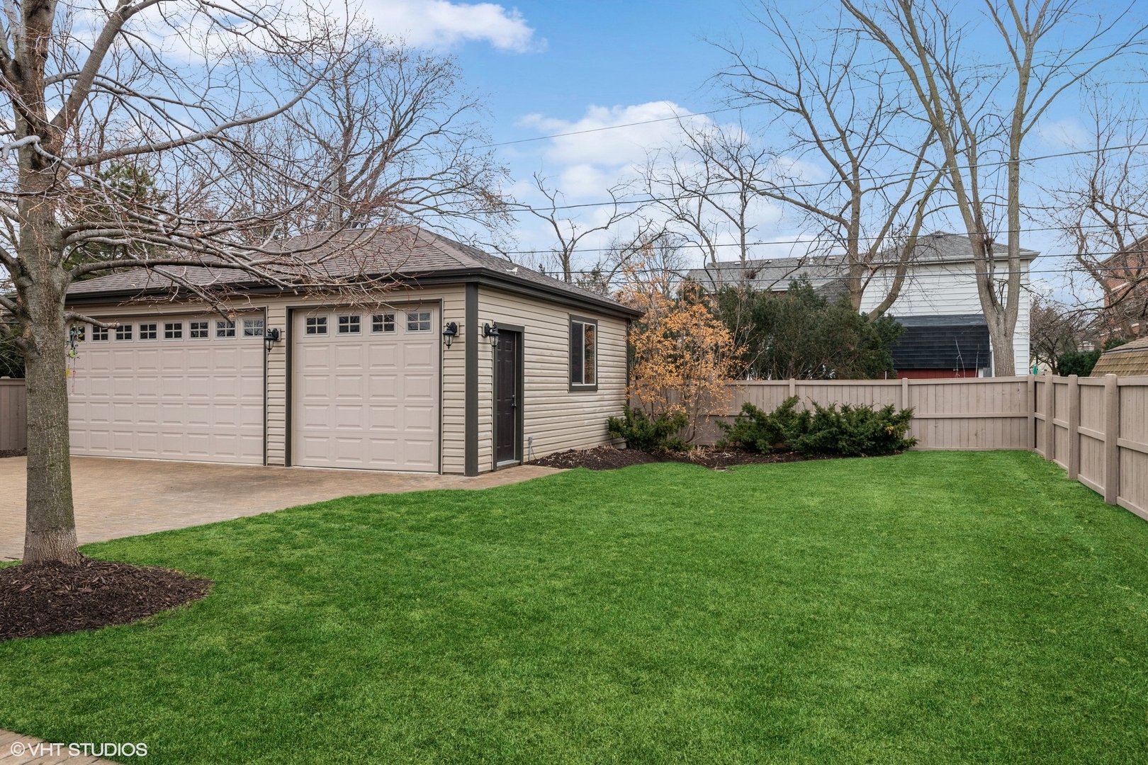 1761 Elliott Street Park Ridge, IL 60068 - Photo 33 of 37 a white house that has a tree in front of it