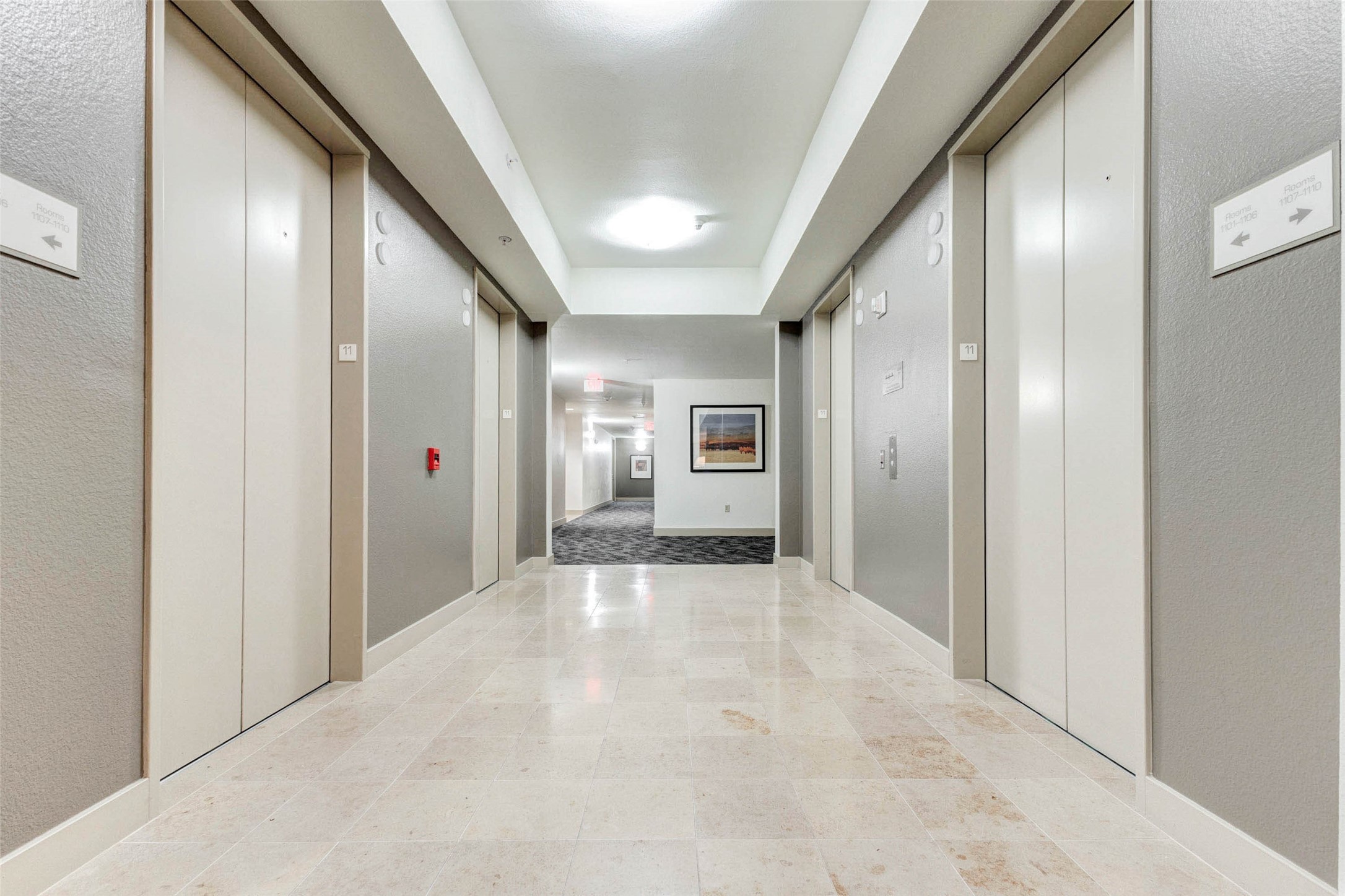 3505 Sage Road, Unit 1104 Houston, TX 77056 - Photo 4 of 31 Step into a clean, modern elevator lobby that sets the tone for upscale high-rise living at The Mark. Neutral tones, bright overhead lighting, and polished stone flooring create a welcoming and refined atmosphere for residents and guests. Multiple elevators offer convenient access to each floor, while the thoughtfully designed hallway provides a quiet transition between the building’s shared spaces and private residences.