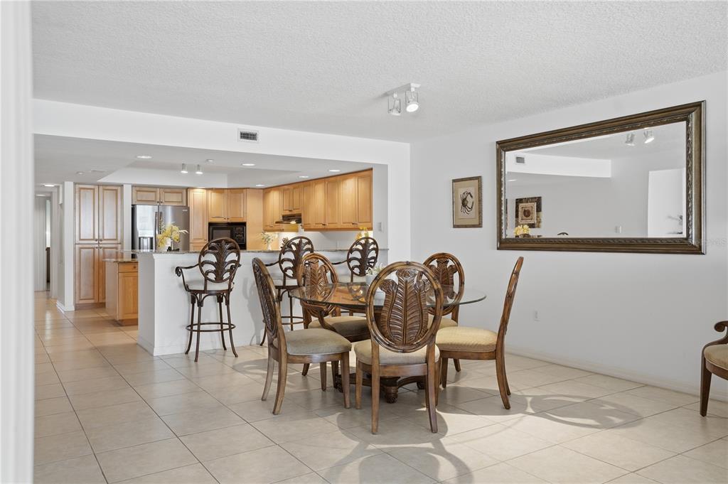 16326 Gulf Boulevard, Unit 307 Redington Beach, FL 33708 - Photo 10 of 43 a view of a dining room and livingroom with furniture