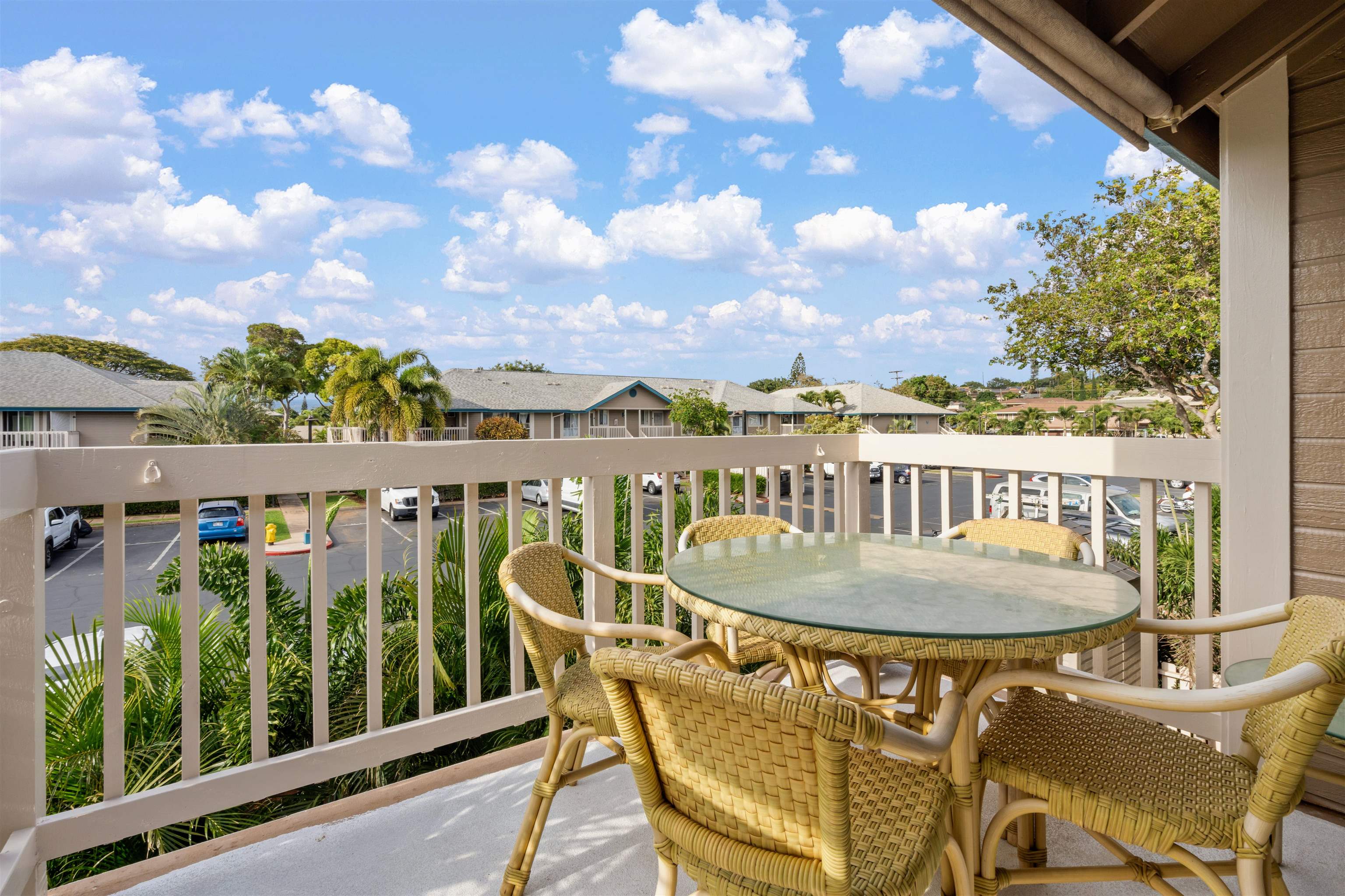 480 Kenolio Road, Unit 11206 Kihei, HI 96753 - Photo 11 of 31 a view of a balcony dining area with furniture