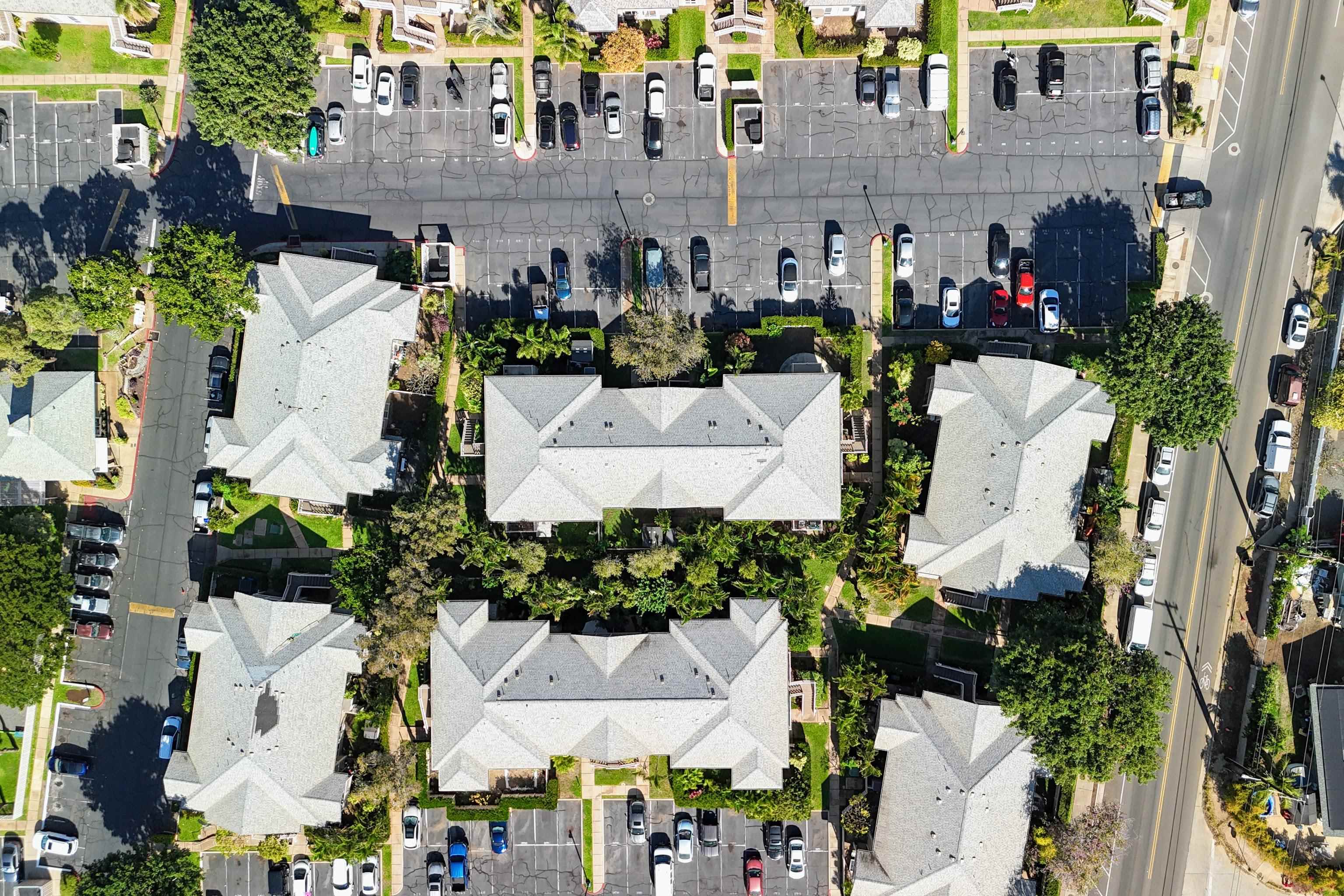 480 Kenolio Road, Unit 11206 Kihei, HI 96753 - Photo 24 of 31 an aerial view of multiple houses with outdoor space