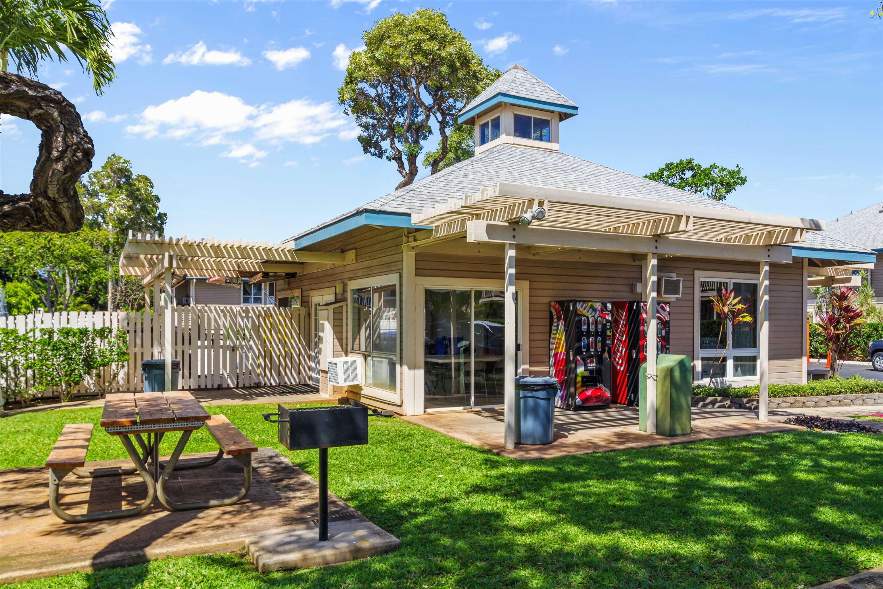 480 Kenolio Road, Unit 11206 Kihei, HI 96753 - Photo 29 of 31 a view of a chairs and table in a yard