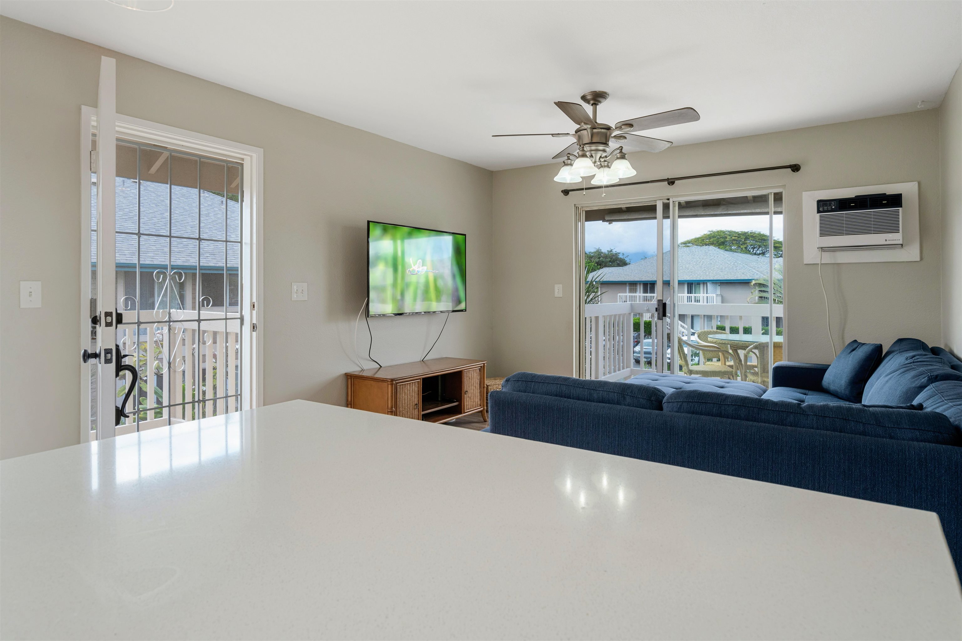 480 Kenolio Road, Unit 11206 Kihei, HI 96753 - Photo 7 of 31 a living room with furniture and a large window
