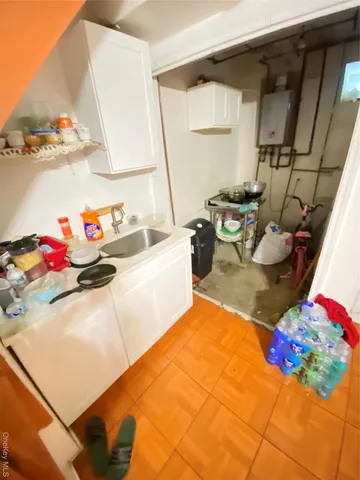 a bedroom with a bed and a lamp