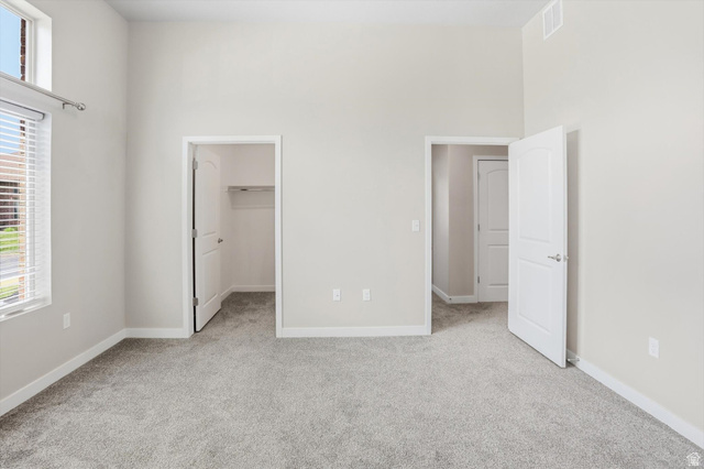 1838 West 300th Street South, Unit B Mapleton, UT 84664 - Photo 22 of 51 Room featuring vaulted ceilings, light gray wall paint, and gray carpet flooring